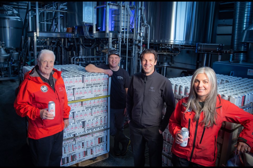 North Shore Rescue members Gerry Brewer, Mike Danks and Athena Athena Calogeros launch Trip Plan IPA with Bridge Brewing production manager Landis Fortier (leaning on beer) on Feb. 15.