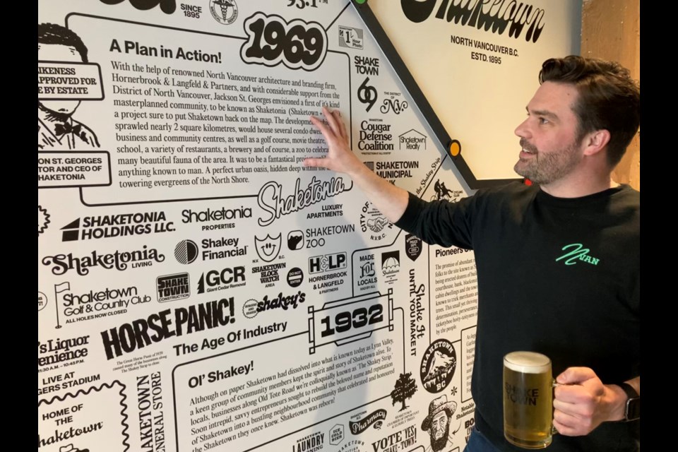 Shaketown Brewing Co.'s co-founder Ryan Scholz shows off some of the suspect "historical" references that are posted around the brewery and tasting room. 