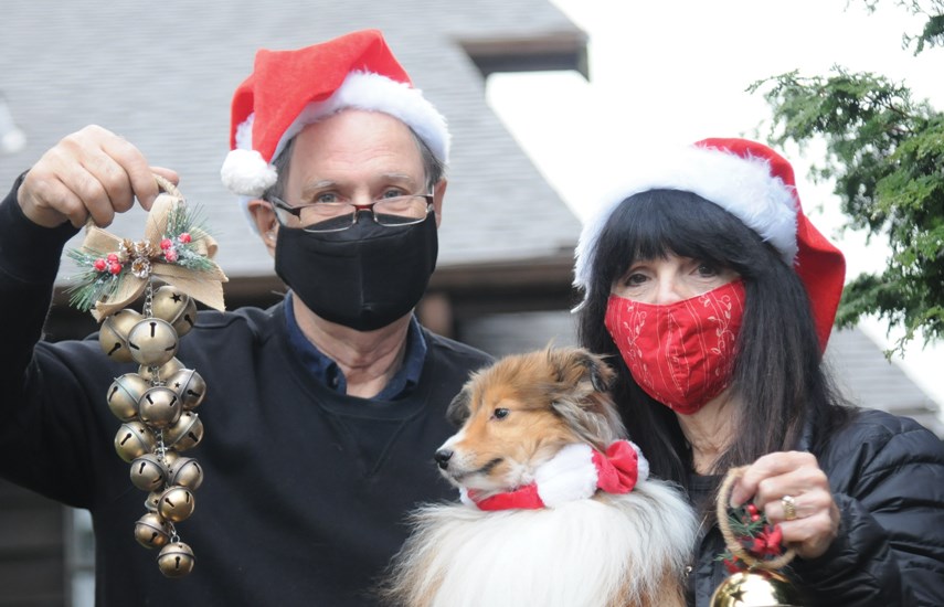 North Vancouver's Colin and Laurel Gurnsey and their Shetland sheepdog Keira are ready to ring bells on Christmas Eve, hoping others will follow. The worldwide event happens at 6 p.m. local time on Dec. 24, 2020. photo Mike Wakefield, North Shore News