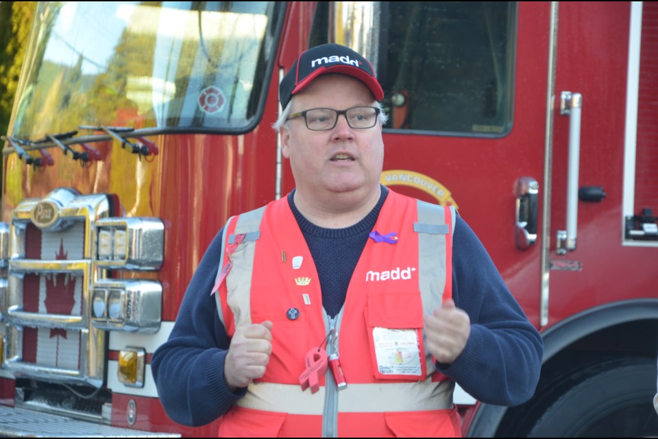 Charlie Grahn, treasurer and board member for MADD Metro Vancouver, launches the 35th annual Project Red Ribbon campaign in West Vancouver. | North Shore News / Mina Kerr-Lazenby