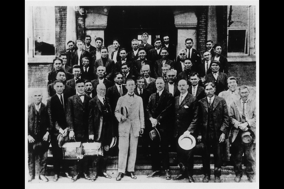 Family representatives and Chiefs from Squamish villages, along with Indian Affairs officials (in the front row). The photo was taken in 1923 at the Sinclair Building in Vancouver. 