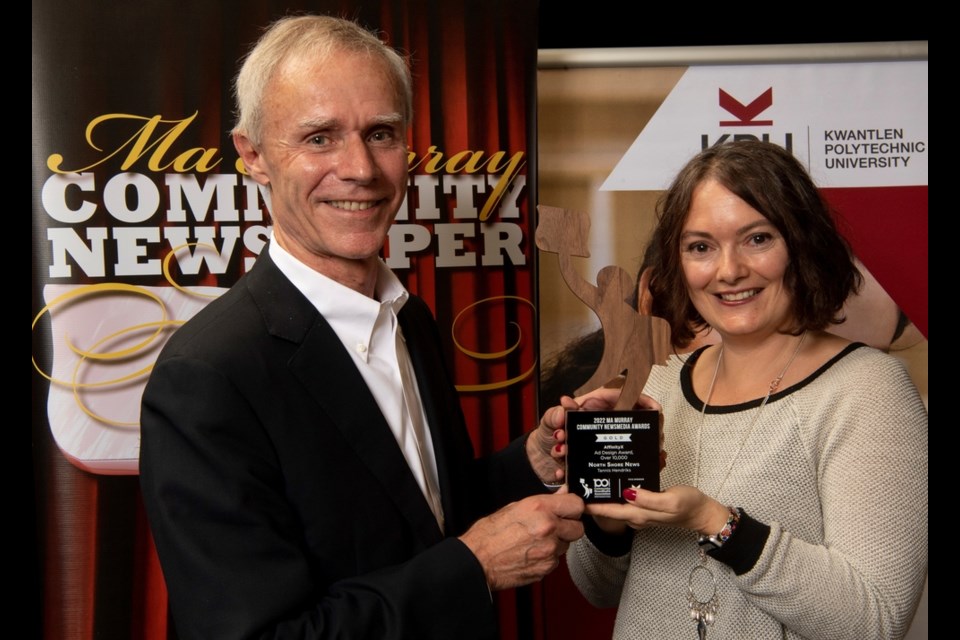 David Grant of AffinityX presents North Shore News' Tannis Hendriks with a gold award in the AffinityX Ad Design, Over 10,000 category, at the BCYCNA Ma Murray Awards, May 14, 2022, at the RIver Rock Casino Resort in Richmond.