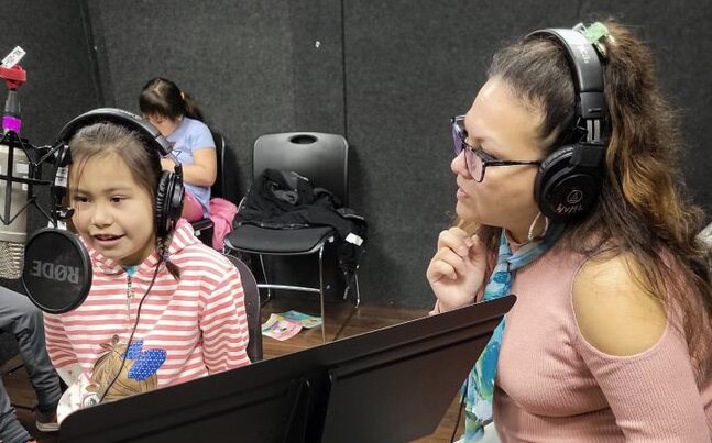 Tsitsáyxemaat Rebecca Duncan and her students from Capilano Littlest Ones School records an audio tour of the library's native plant garden in the Squamish language. 