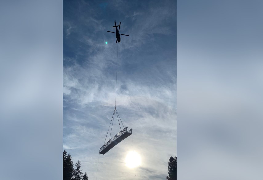 Talon Helicopter pilots lift off from Cypress Bowl Road with a 50-foot trail bridge to be installed over West Vancouver's Brothers Creek, Monday, Nov. 1, 2021.