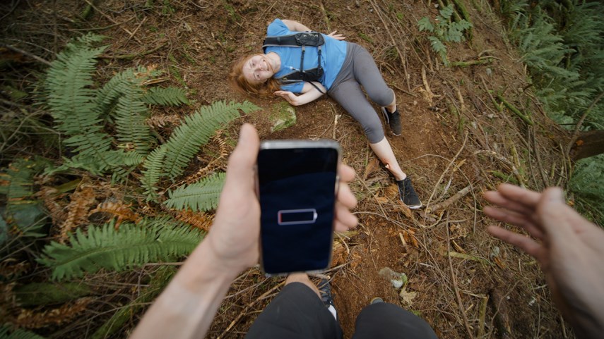 The unnamed central character of North Shore Rescue's 'Survive your own adventure' video attempts to call for help only to find his phone's battery is dead.