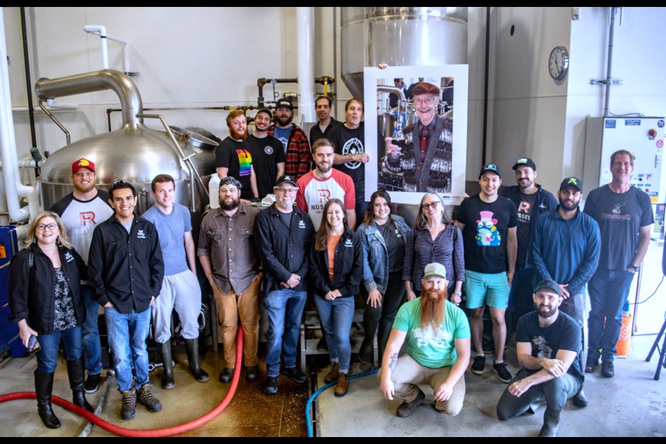 Students from Kwantlen Polytechnic University's brewing school alongside staff at Russel Brewing celebrate brew day for the John Mitchell Tribute Ale.