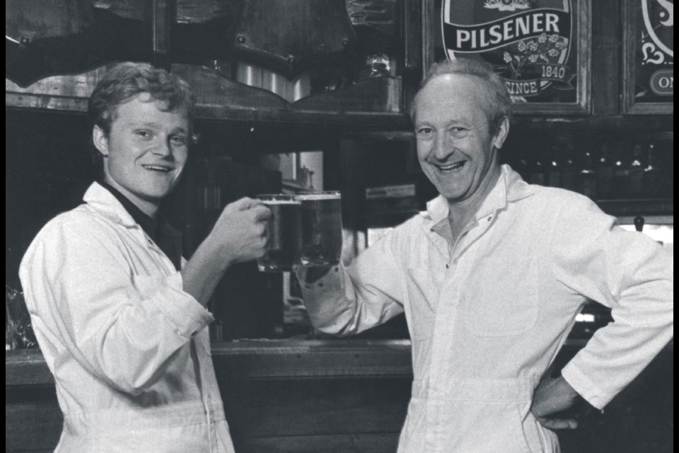 John Mitchell (right) and son Edward say cheers with one of the first legal craft beers in the country at the Troller Pub in 1982.
