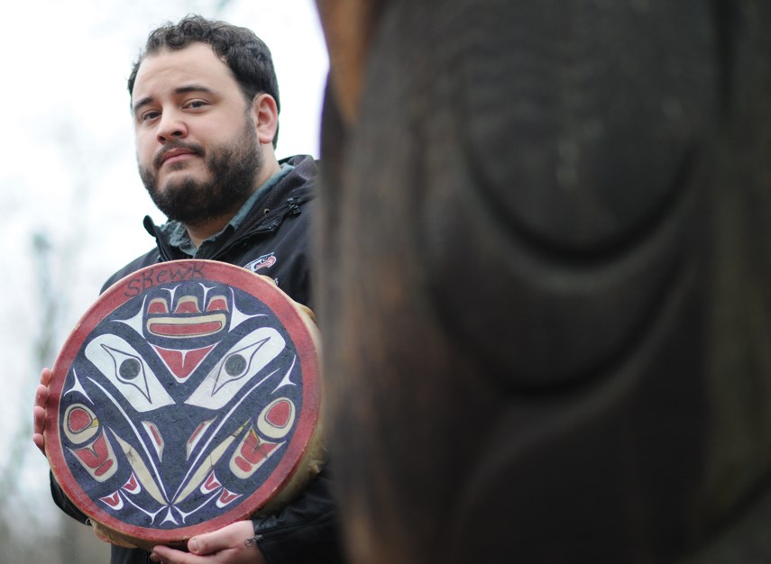 Jullian Kolstee holds a depiction of Skewk, the raven, in tribute to his father Anton. A beloved teacher and ally for Indigenous students at Carson Graham Secondary, Anton died of COVID-19 on Dec. 8, 2020.