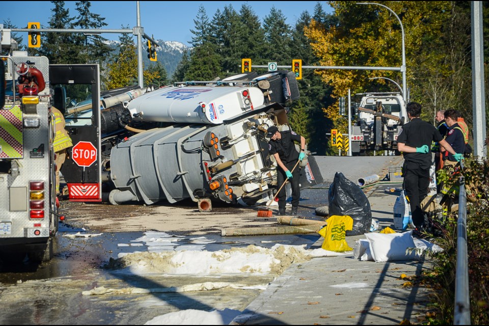 White powder poured on the roadway absorbs liquids spilled in the crash.