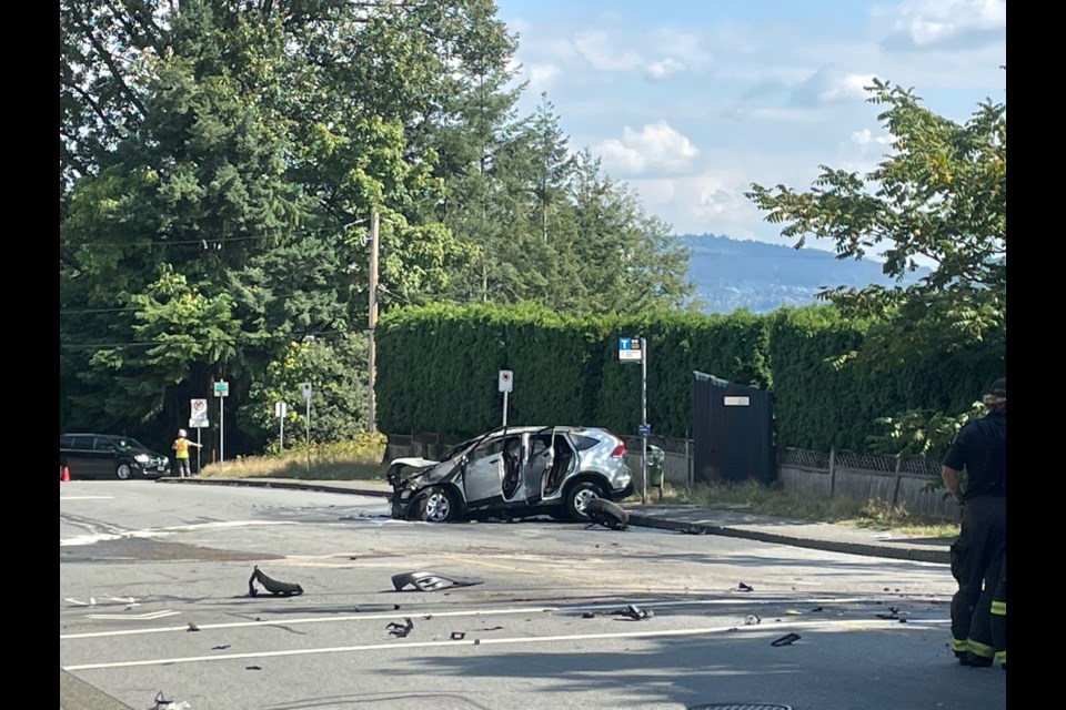 Debris is strewn across the road after a single-vehicle collision on Keith Road East sent a woman to hospital Wednesday afternoon, police say.