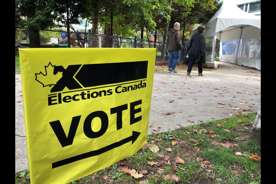 Voters attend a North Shore polling station, Sept. 20, 2021.