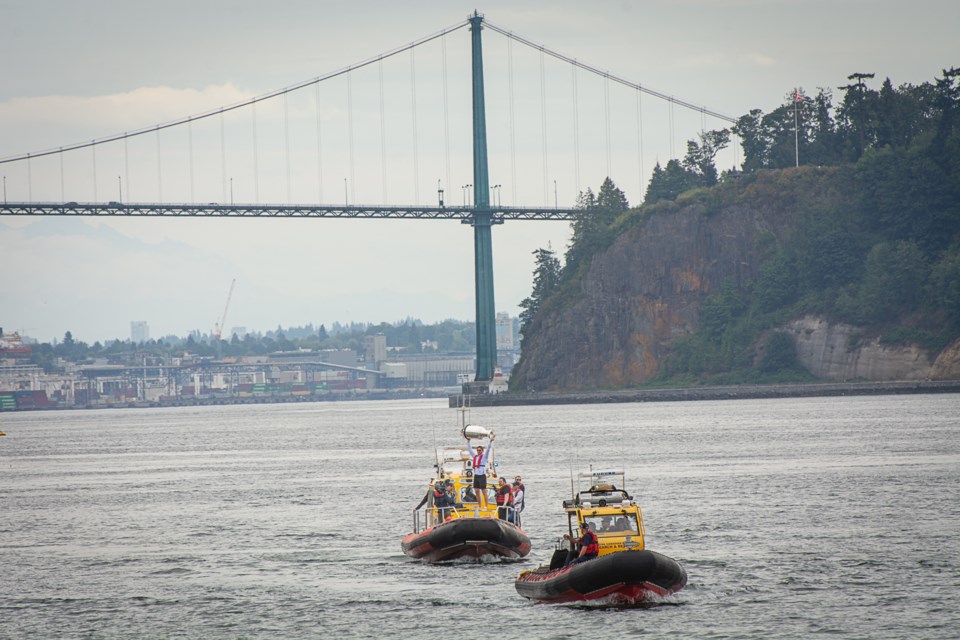 Sam Reinhart brings the Stanley Cup under the Lions Gate Bridge aboard a Royal Canadian Marine Search and Rescue boat on Aug. 19, 2025.
