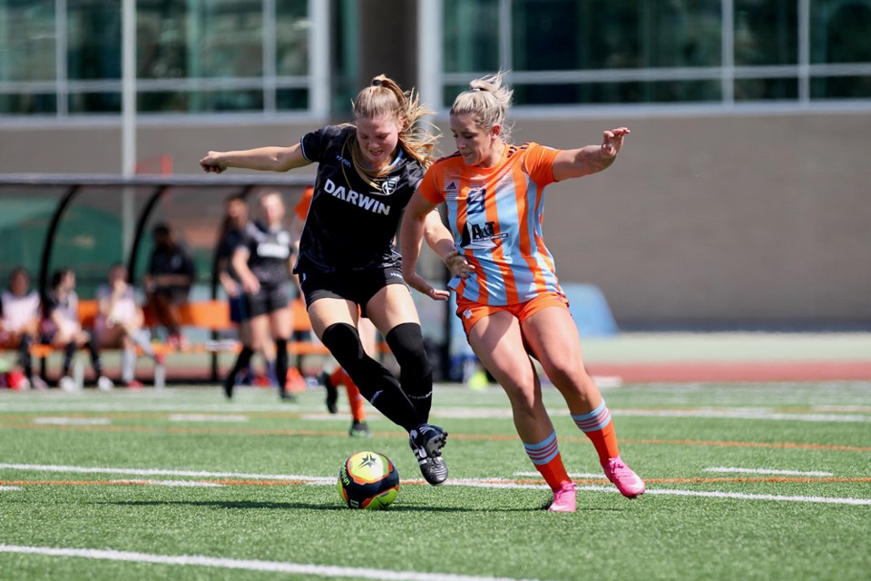 Aurora Hughes-Goyette from Altitude FC jostles with a Rivers FC player during a League1 BC game Sunday in Kamloops. The Altitude FC men and women will play their first ever home games May 29 at North Vancouver’s Kinsmen Field. 