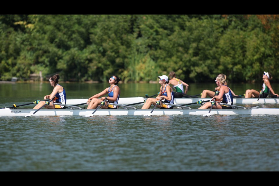 West Van's Elisa Luo exhausted after winning bronze in quadruple sculls. She also won silver in eight with coxswain rowing.