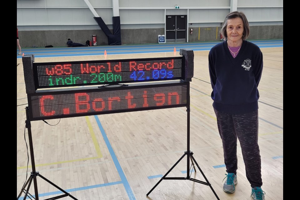 West Vancouver's Christa Bortignon shows off her 200-metre dash time at the BC Masters Indoor Championships held Feb. 25-27 in Kamloops. Bortignon set four world records in the 85+ age group at the event. 