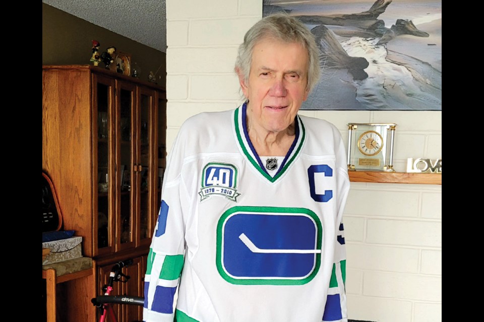 West Vancouver's Joseph Borovich sports a jersey bearing the original 'stick in the rink' logo he designed for the Vancouver Canucks. 
