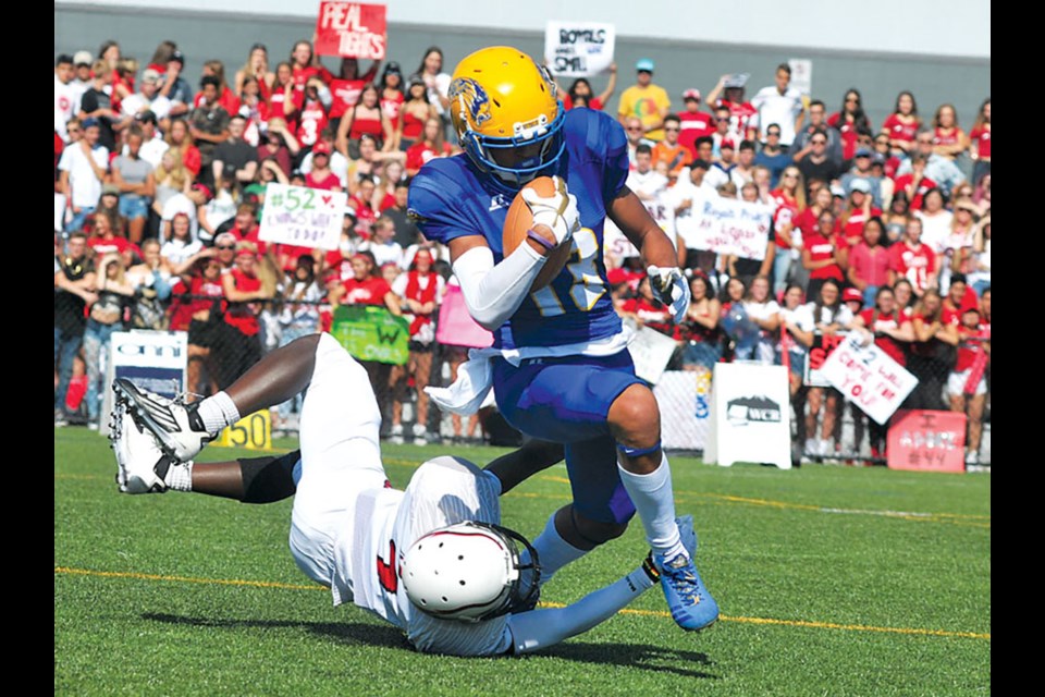 Keelan White makes a play for the Handsworth Royals against Carson Graham in Buchanan Bowl 31 played in 2017. On Tuesday White was selected third overall in the CFL draft. | Paul McGrath / North Shore News