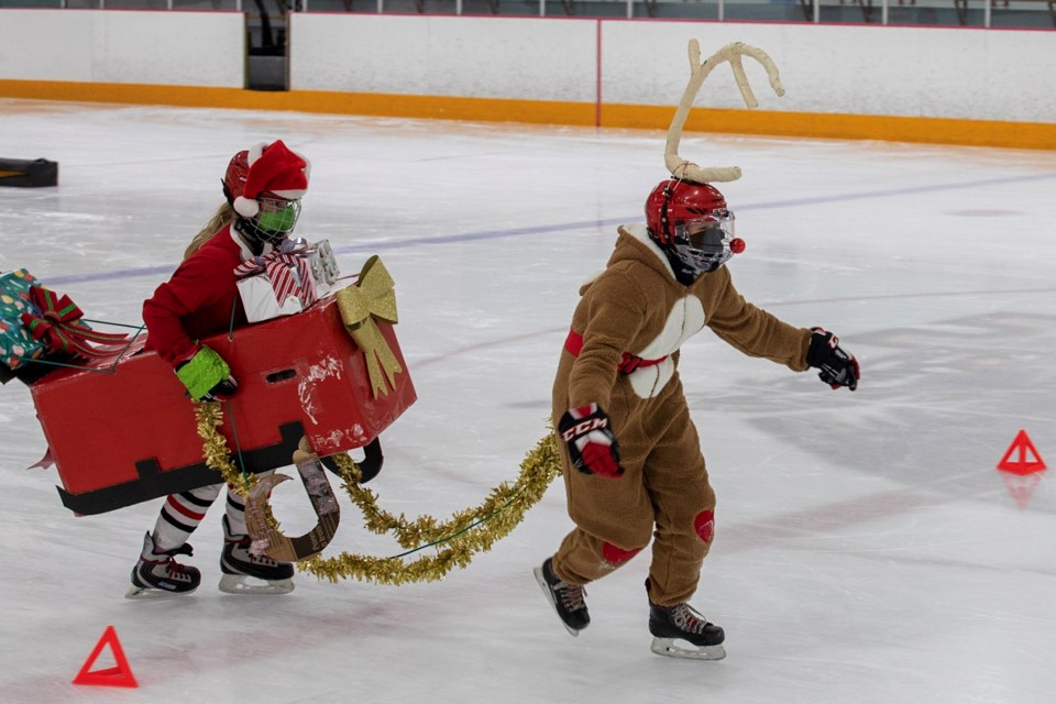 Members of the NSWC U13 C1 girls team complete a Christmas costumed, COVID-safe charity skate-a-thon Dec. 12 at the North Shore Winter Club. 
