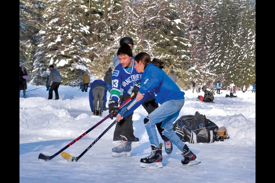 Pond hockey enthusiasts enjoy the results of days of below-freezing temperatures at Rice Lake. Dozens of rinks were cleared of recent snowfall and pucks were dropped.