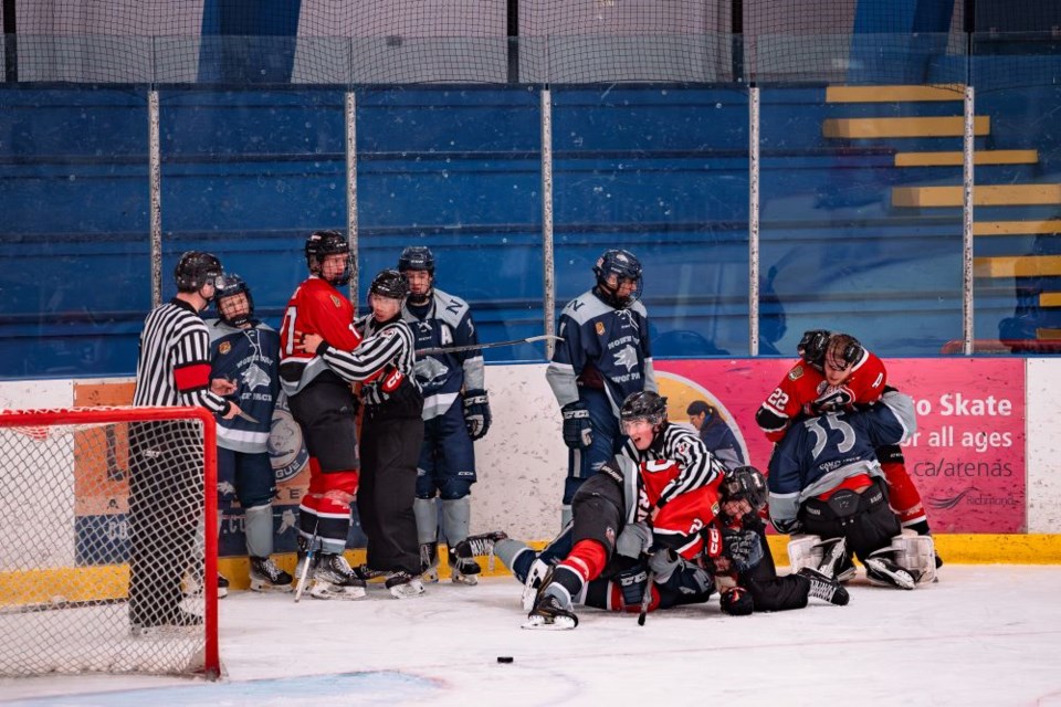 A brawl breaks out in the third period of last Thursday's game between the North Van Wolf Pack and the Richmond Sockeyes. | Norman Laver