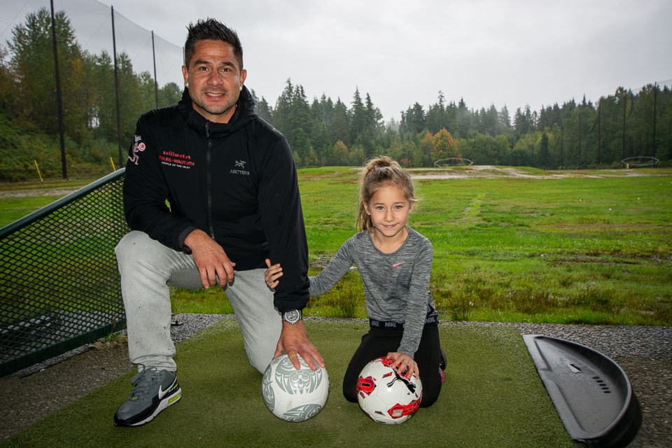 Whonoak (Dennis Thomas), elected councillor for Tsleil-Waututh Nation, and his daughter Oaklynn Thomas (6) look forward to the opportunities that the new turf field will bring. | Nick Laba / North Shore News