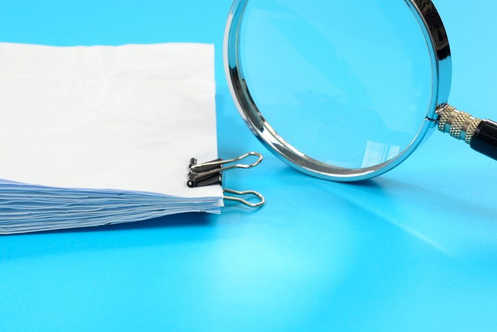 paperwork & magnifying glass