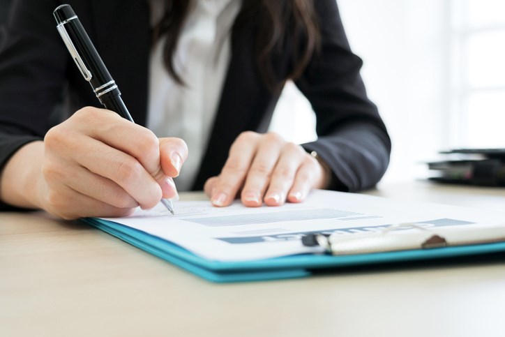 woman signing contract