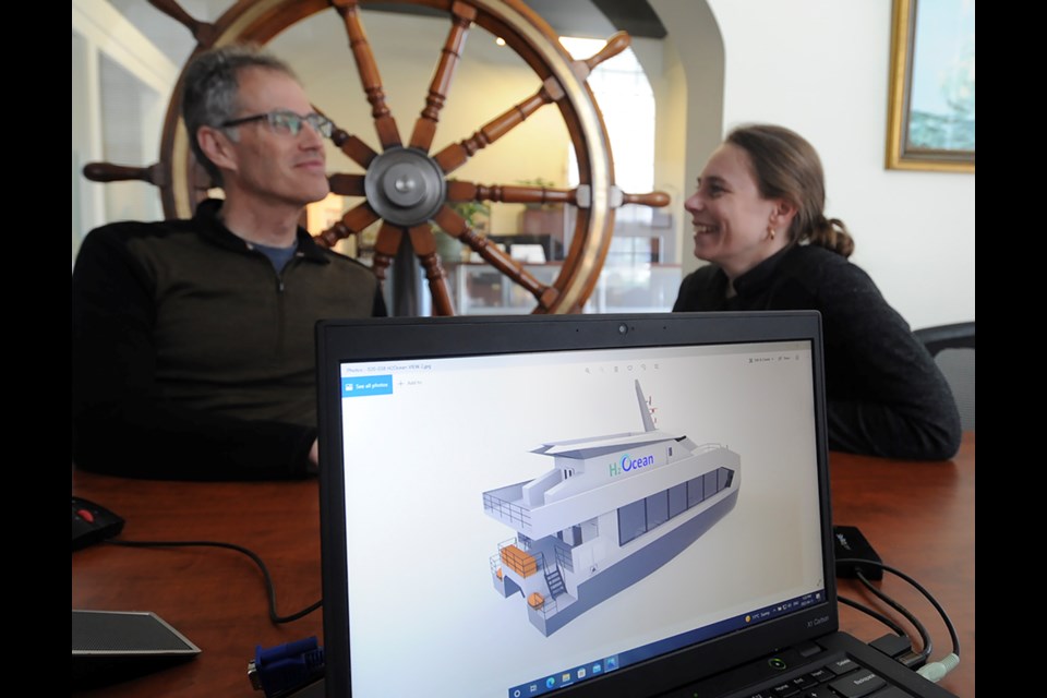 Capilano Maritime Design president Chris Mulder and project manager Anna Bruns proudly display the digital rendition of the H2Ocean vessel, the first hydrogen-powered harbour boat planned to hit the water in Canada.