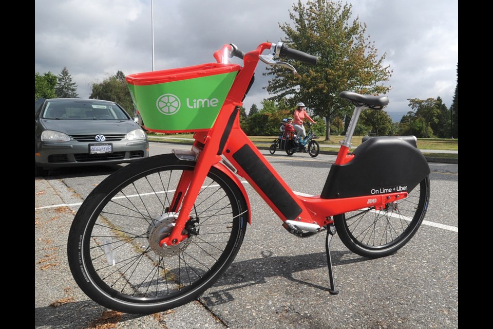 A lone Lime e-bike parked on West Grand Boulevard awaits a rider, on Aug. 23, 2021. The e-bike share is a two-year pilot program in North Vancouver.
