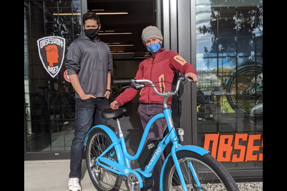 Kristian Miller and Natalie Lauzon get ready to go electric at the new e-bike only location of North Vancouver's Obsession: Bikes.