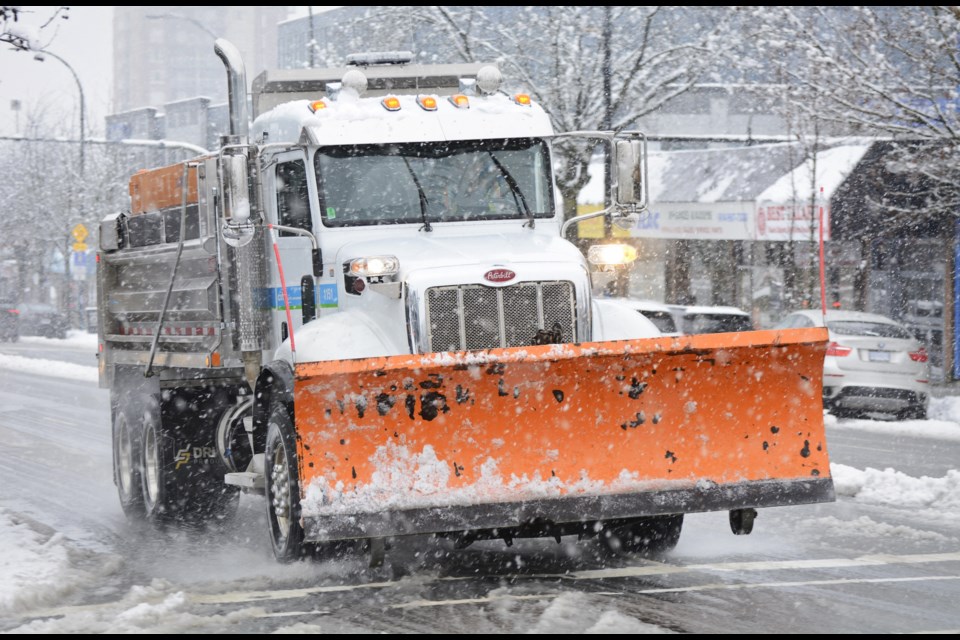 A snow plow works on North Vancouver's Lonsdale Avenue following a snowfall Feb. 28. | Nick Laba / North Shore News