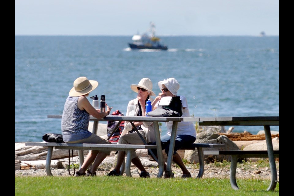 Continued warm weather means North Shore residents will still be able to bask in some fall sunshine on Thursday and Friday. Here, folks enjoy the sun at Ambleside in August 2022.