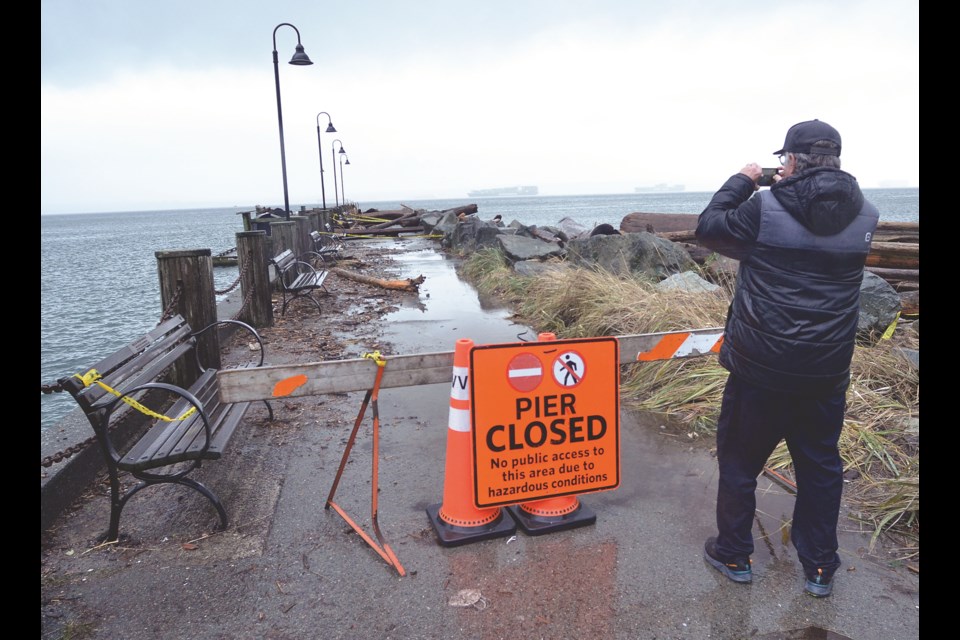 The West Vancouver shoreline and Seawalk received significant damage from Friday's storm surge. Logs and debris cover Dundarave Pier.