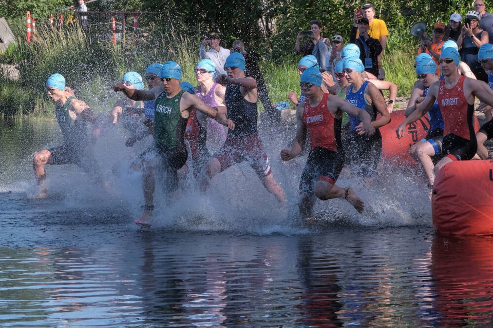 Triathlete James Sikich of North Vancouver bursts out the starting gate and into Nadsilnich Lake in Prince George. He won gold in the boys 16-17 duathlon and silver in four related events.