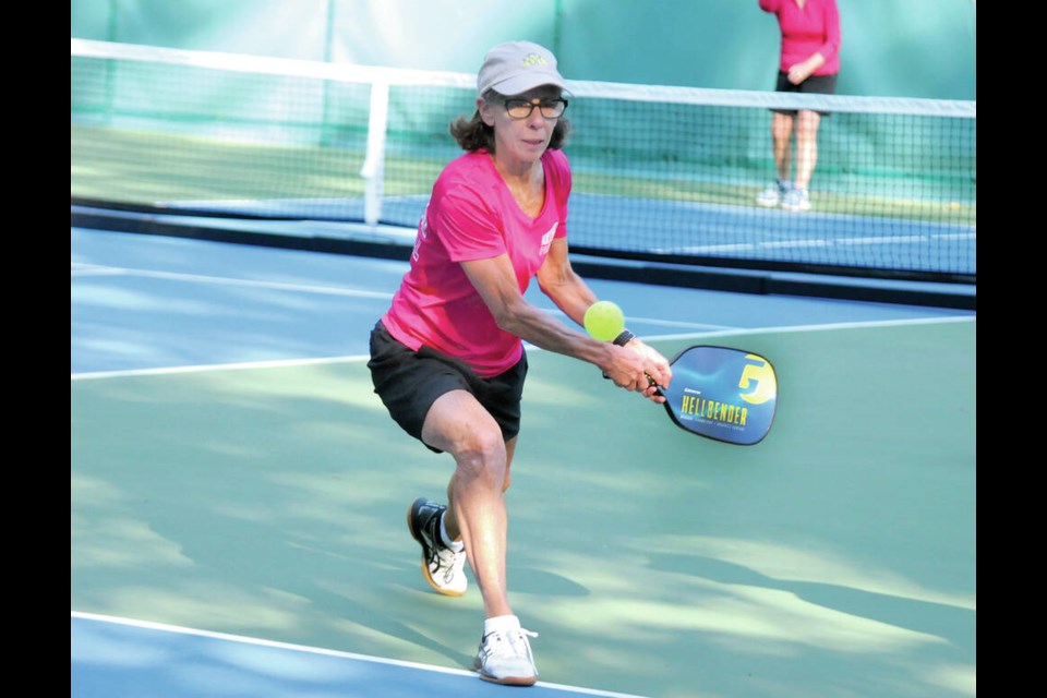 Taking advantage of beautiful early autumn weather, members of the North Shore Pickleball  Club enjoy the newly opened courts at Little Cates Park in North Vancouver. Here, club vice-president Karen Wilson returns a shot. | Paul McGrath / North Shore News