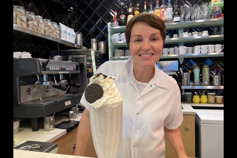 Douce Diner owner and chef Dawn Doucette whips up one of her famous hand spun milkshakes, this one a Cookies and Cream concoction featuring an Oreo on top. | Andy Prest / North Shore News 