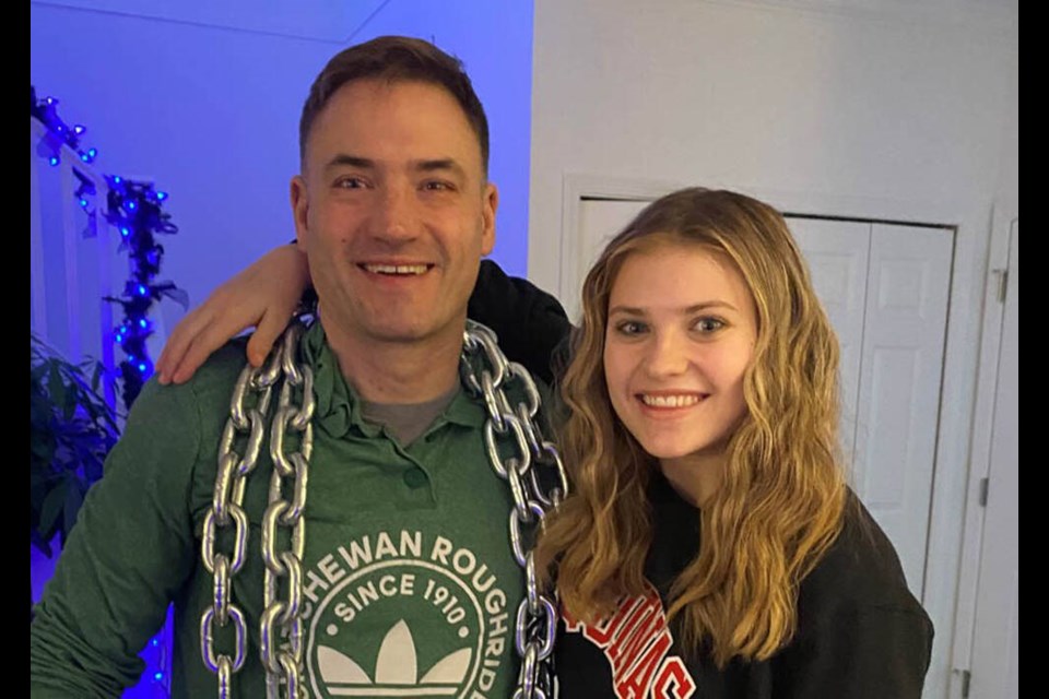 Chris Haines poses for a family photo with his daughter Grace in December 2020, before the teen was struck by a hit-and-run driver. | Chris Haines 