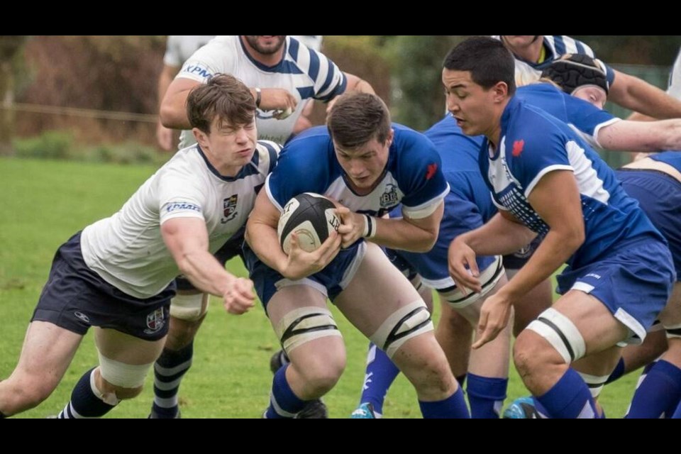 Nick Allen (centre) plays alongside friend and teammate Jacob Ikeda (right) for the UBC Thunderbirds. | Courtesy of Ben Rebalski 