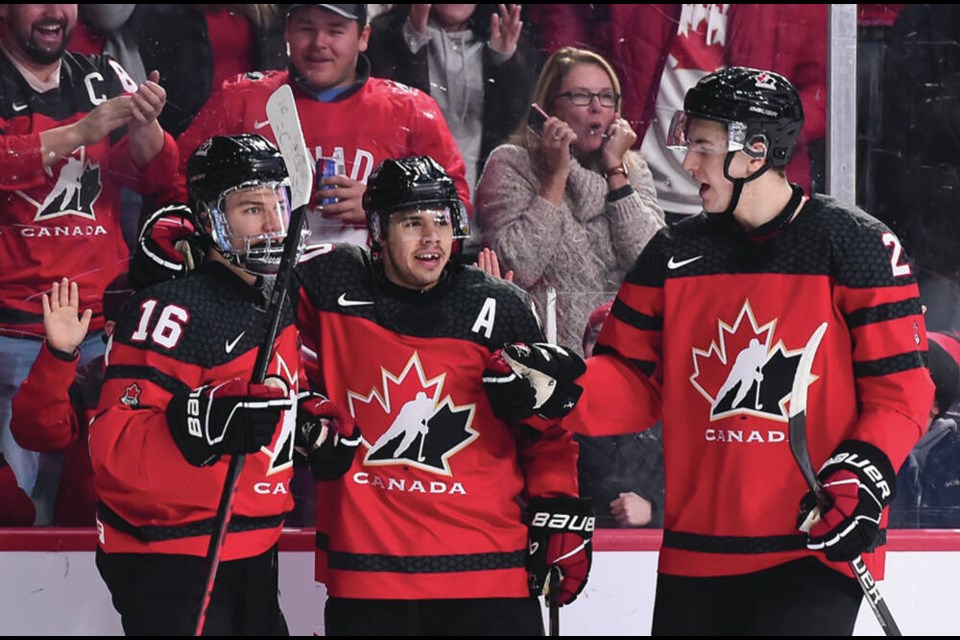 Connor Bedard, Logan Stankoven and Zack Ostapchuk celebrate a goal for Team Canada during a win over Germany at the world junior championships in Halifax Dec. 28, 2022. Bedard is one of several North Shore hockey players to have scored a huge overtime goal recently.| @HockeyCanada/Twitter 