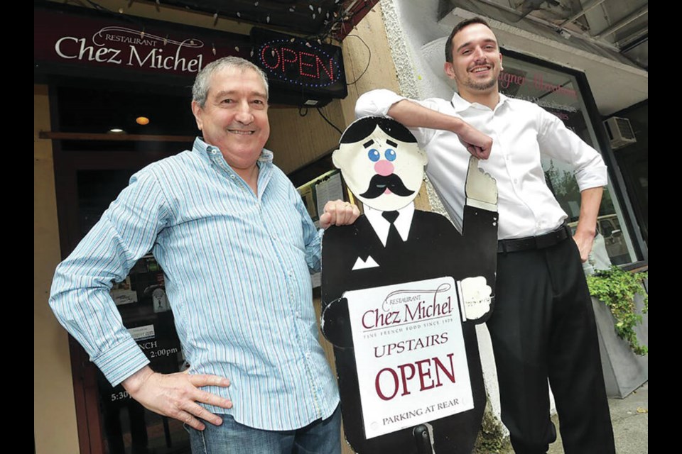 Michel Segur and his son Julien stand proudly outside West Vancouver's Chez Michel in 2017. Segur, who died on Dec. 11, 2022, opened the iconic North Shore restaurant in 1979. | Paul McGrath / North Shore News 