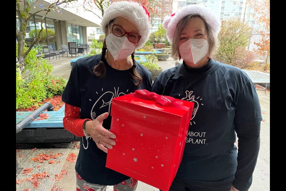 North Vancouver organ donor recipients and Margaret Benson and Elizabeth Edward deliver gift baskets of popcorn to medical staff at Lions Gate Hospital on Thursday, Dec. 8.| Jane Seyd, North Shore News 