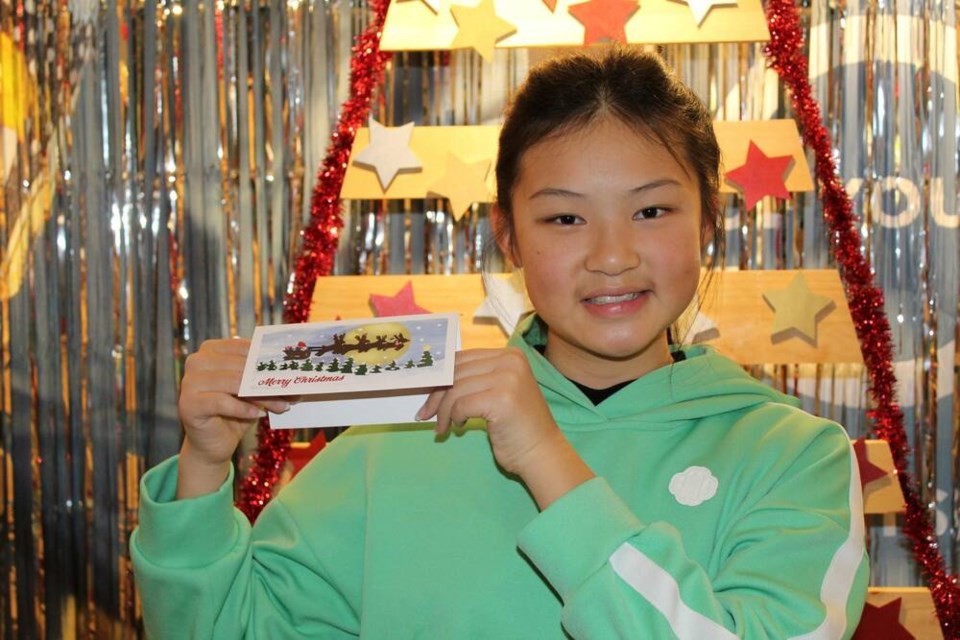 Ecole Sentinel Secondary student Vivian Song shows her winning artwork for Lions Gate Hospital Foundation's Design a Christmas Card Competition. | Lions Gate Hospital Foundation