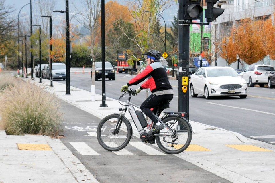 Recently installed bike lanes on Esplanade Avenue separate cyclists from vehicle traffic. | Paul McGrath / North Shore News 