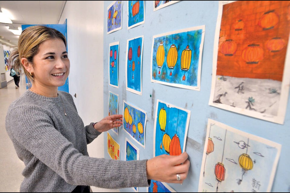 Seymour Heights elementary vice-principal Joanna Lane displays some of the drawings of Chinese lanterns created by her Grade 6/7 class students for the school's Lunar New Year celebrations. | Paul McGrath / North Shore News 