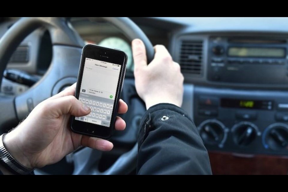 Texting while driving will net you a $368 fine, even if you're stopped at a light. | Dan Toulgoet / Vancouver Courier