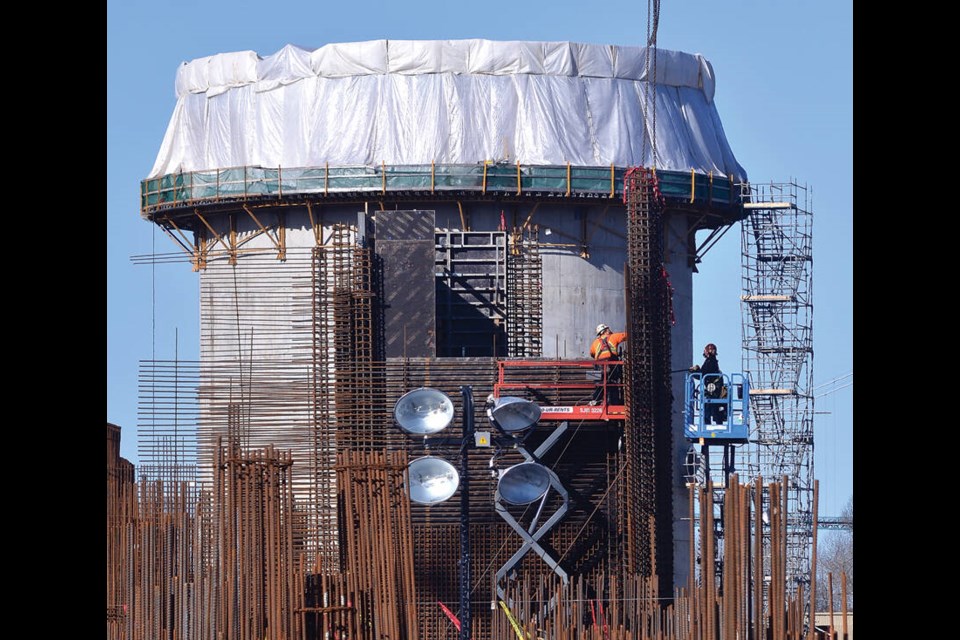 Rows of rebar stand in front of a sludge disgester tower during work on the massive new sewage treatment plant in North Vancouver in March of 2021. | Paul McGrath / North Shore News 