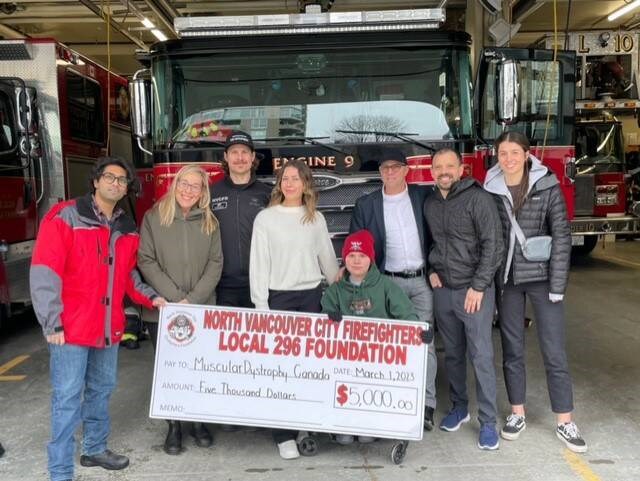 Muscular Dystrophy B.C., Community Fundraising Officer Rahul Rajanala, teacher supporter Nancy Dixon, MD Chair and Firefighter representative Mark Farally, Jade Stringer, Skyler Stringer, Brad Stringer, North Vancouver RCMP Cpl. Paulo Arreaga and Ella Vogt attending a small check giving ceremony earlier this month. | Brad Stringer 