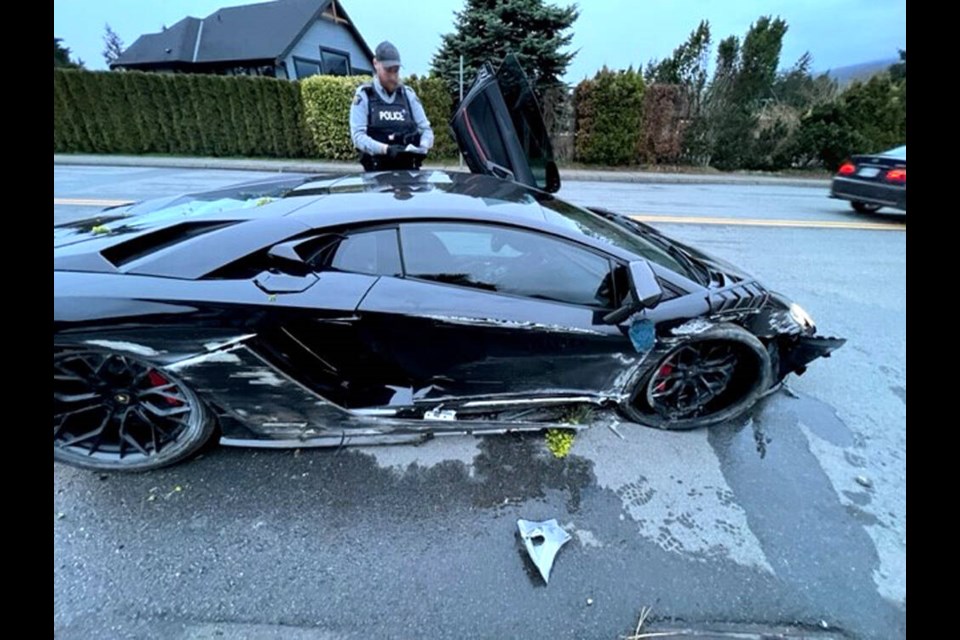 North Vancouver RCMP officers investigate after the driver of a Lamborghini Aventador crashed into a retaining wall in the Canyon Heights area on Saturday, April 22. | Pat Bell 
