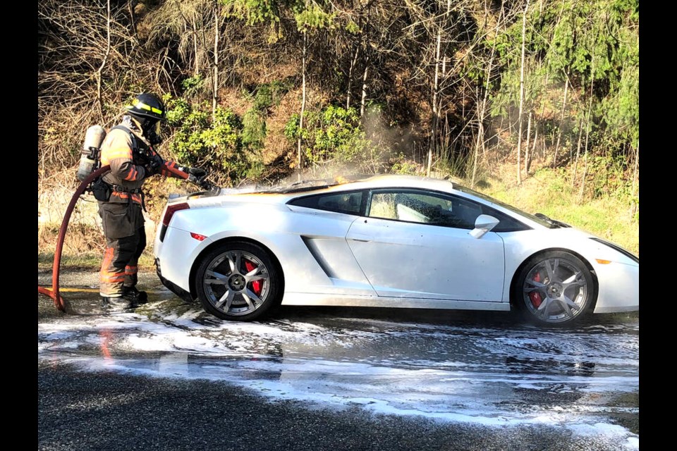 West Vancouver Fire & Rescue crews deal with an engine fire in a Lamborghini Gallardo on Highway 1, April 3, 2023. | West Vancouver Fire & Rescue