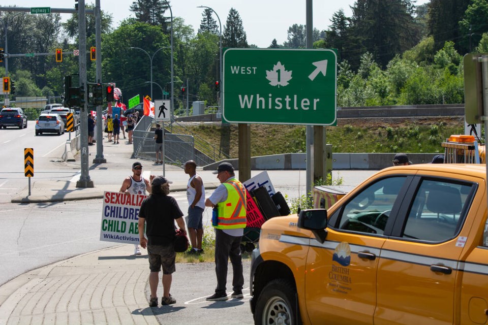 Orange trucks from the Ministry of Transportation and Infrastructure were on site Thursday, along with several police cruisers. | Nick Laba / North Shore News 